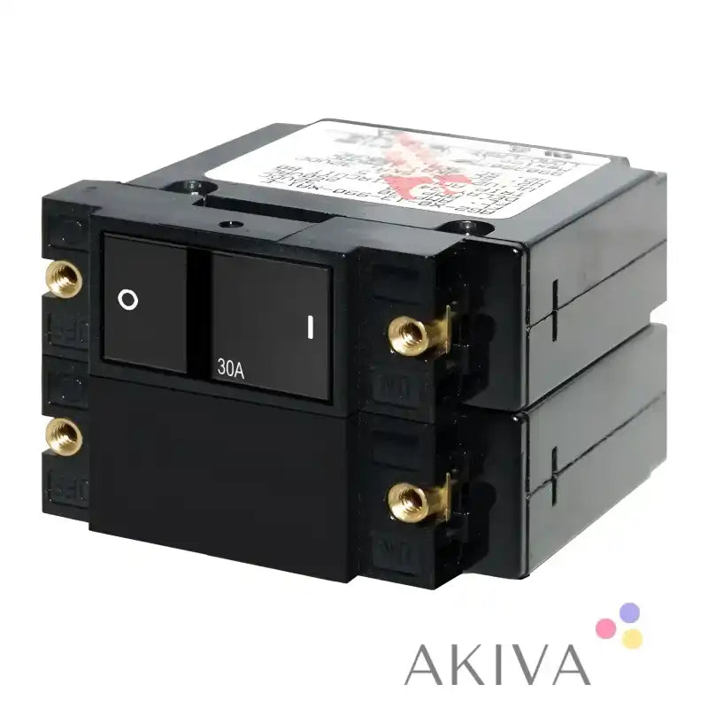 Stacked black Blue Sea Systems flat rocker circuit breakers for reliable electrical protection