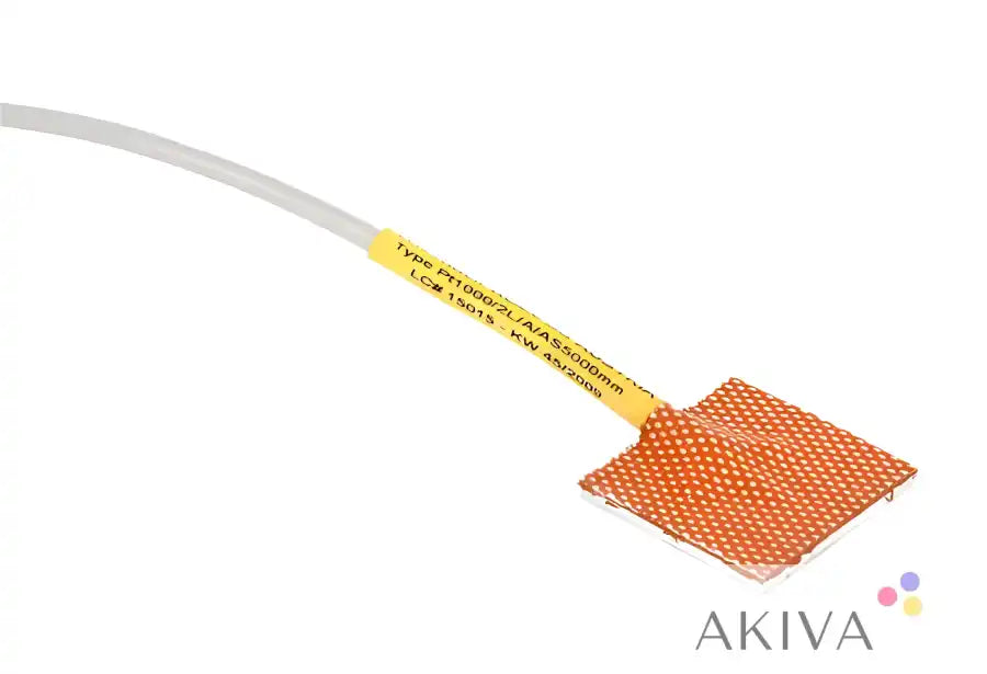 Square orange module temperature sensor with attached cable for precise temperature measurement