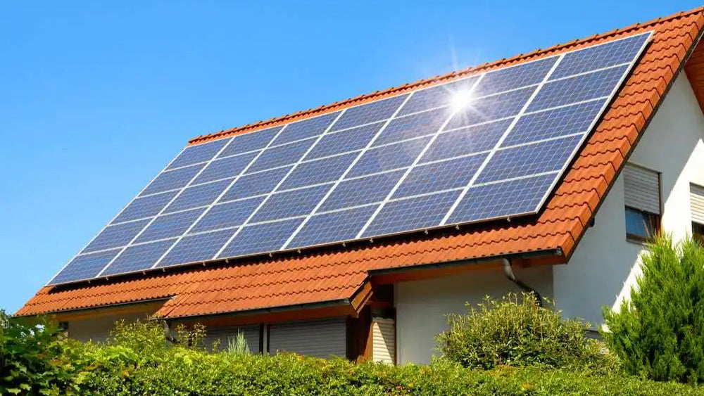 Solar panels on a red-tiled roof.