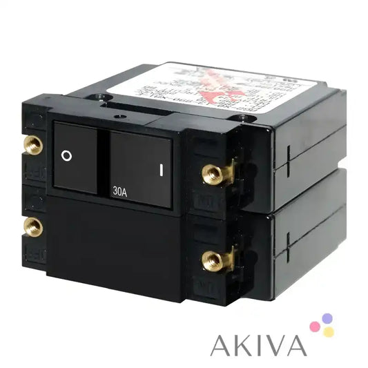 Stacked black Blue Sea Systems flat rocker circuit breakers for reliable electrical protection